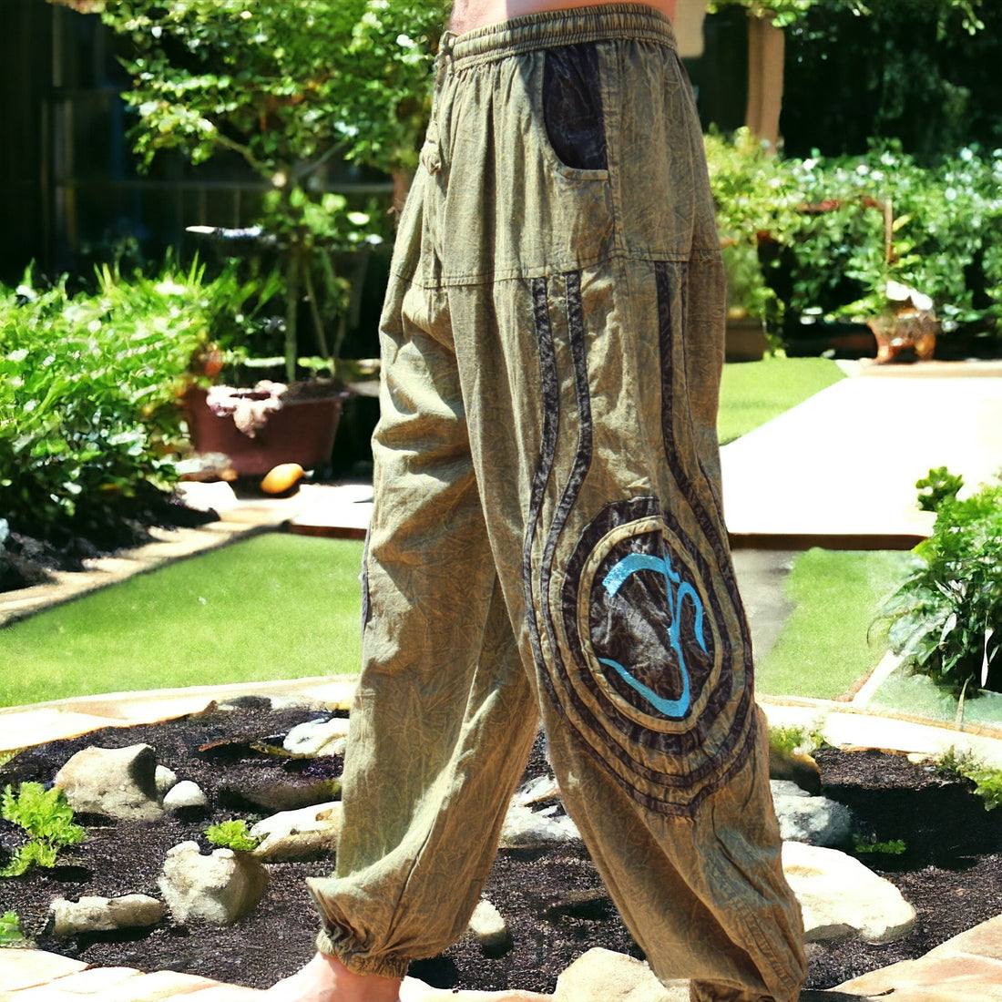 Model showcasing Secret Sense's Earthy Embroidered Harem Pants in a serene garden setting