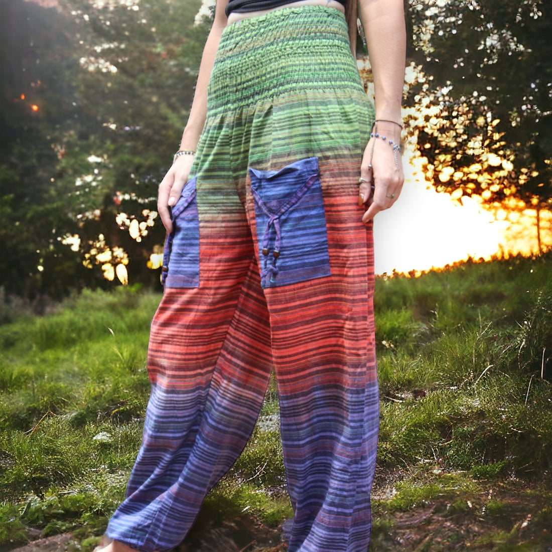 Colorful Secret Sense Forest Striped Harem Pants against a backdrop of dusk